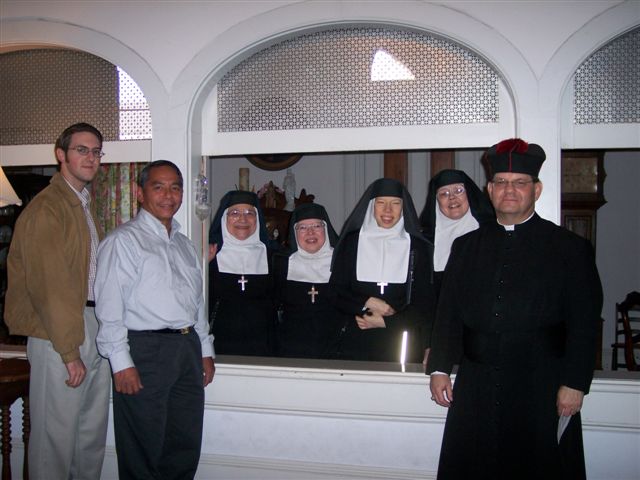 Michael Hyland, Frank Castro and Fr. Perez with some of the Visitatio nuns